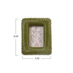 An olive green ribbed square picture frame with dimension markings showing 9.75 inches tall by 7.