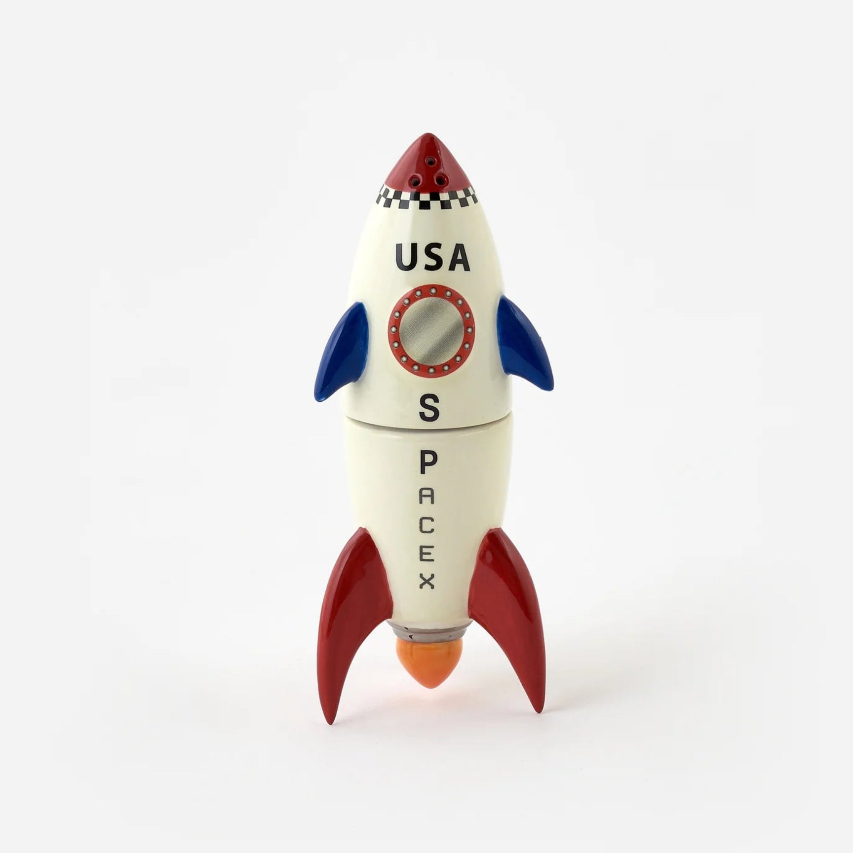 A small decorative toy rocket in a retro space theme, featuring a cream-colored body with red fins and nose cone, blue wings, and black text reading 'USA' and 'SPACE'.
