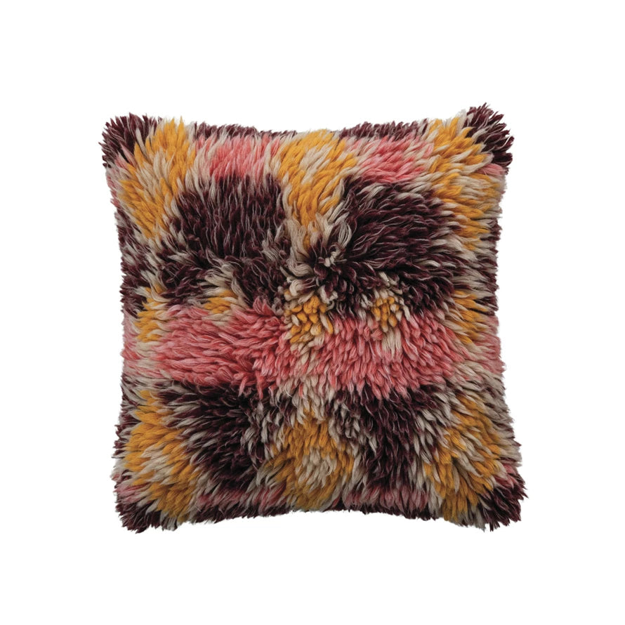 Square wool shag pillow with a multicolor pattern featuring pink, yellow, and dark brown tones for home decor.