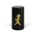 A black cylindrical metal tin with a lid, featuring a gold silhouette of a running figure on the front and the brand name 'SUPERMAN' in gold on the lid, set against a plain white background.