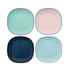 Four colorful square plates on a white background