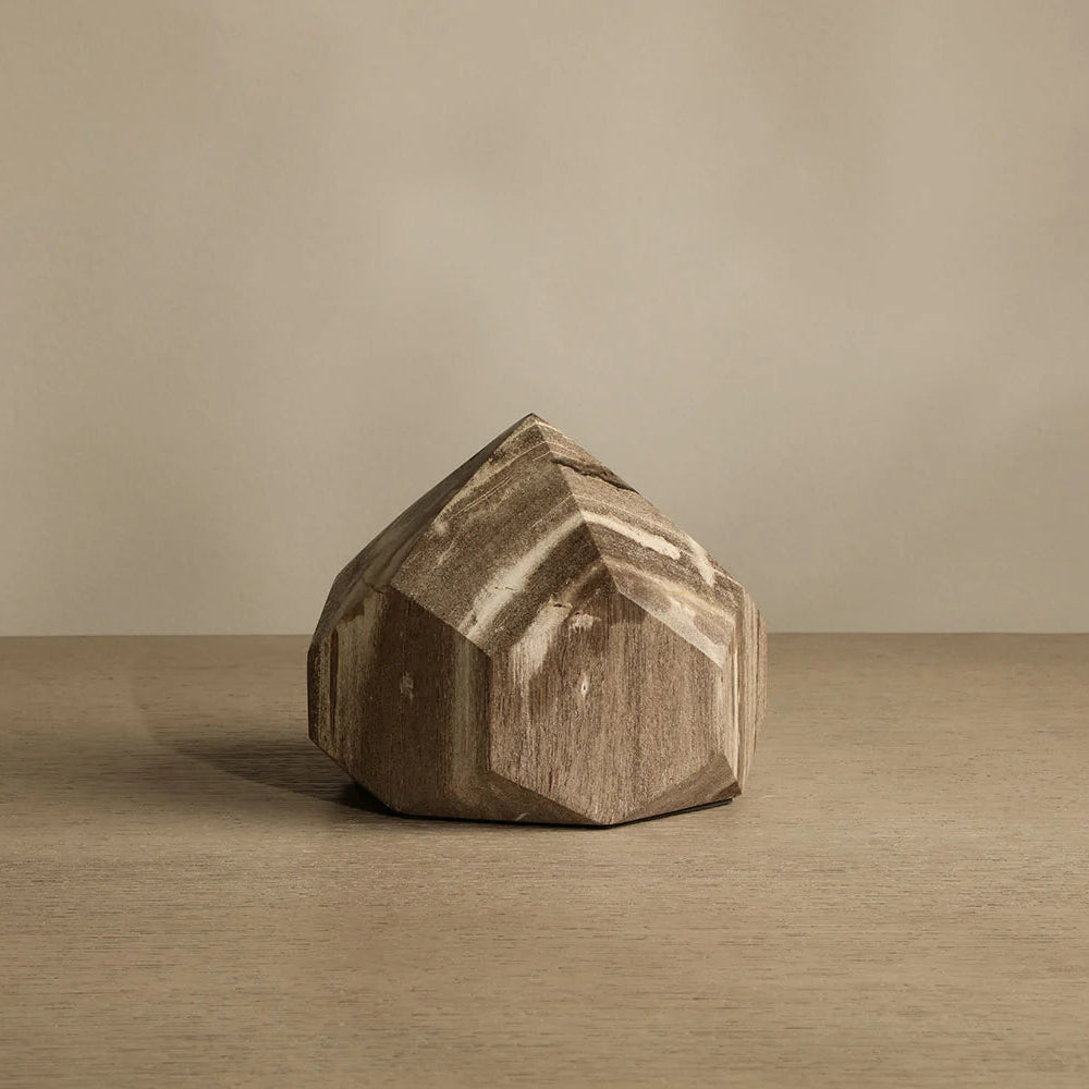 Wooden block with geometric design on a beige background