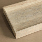 Beige stone countertop on a matching brown background