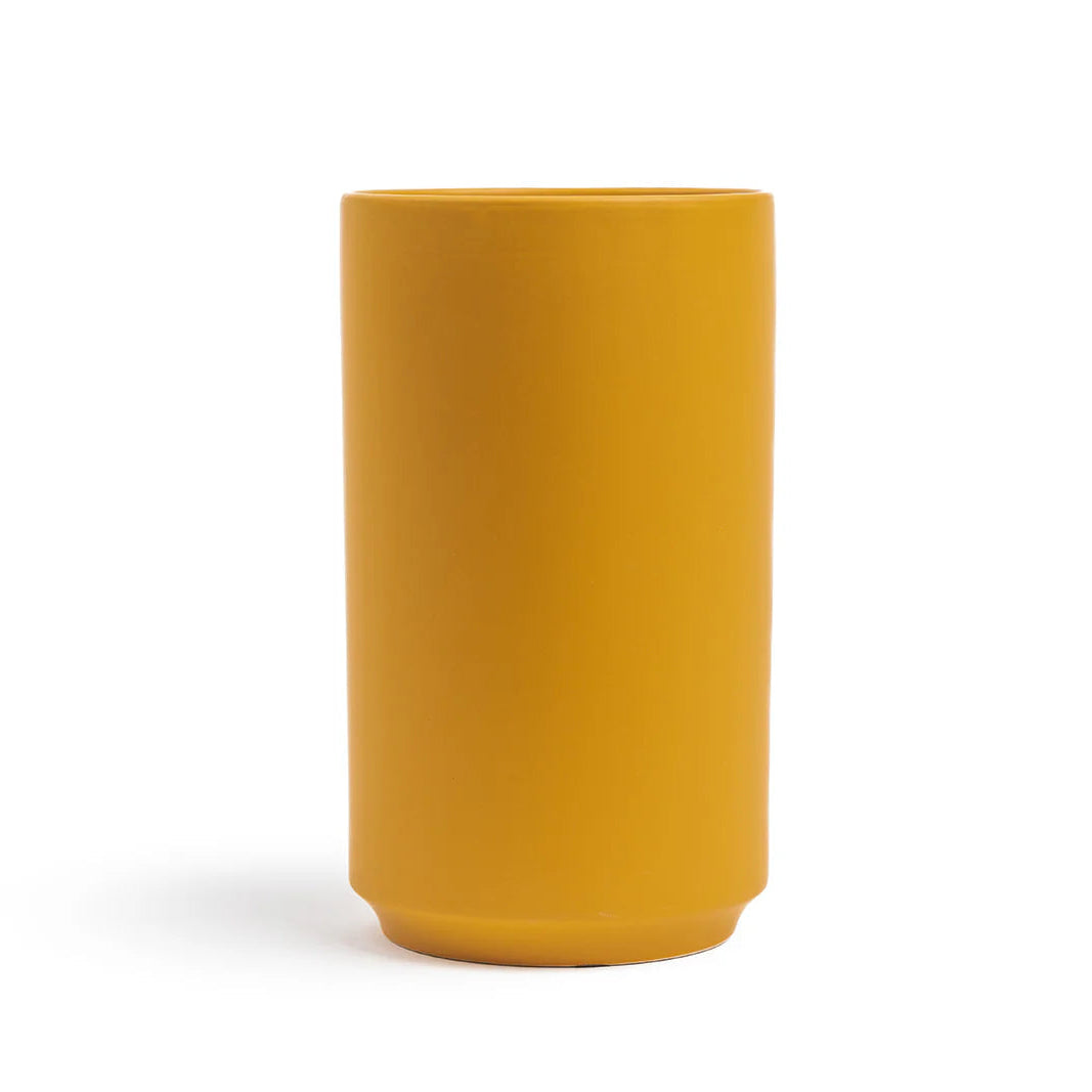 Mustard yellow vase on a white background