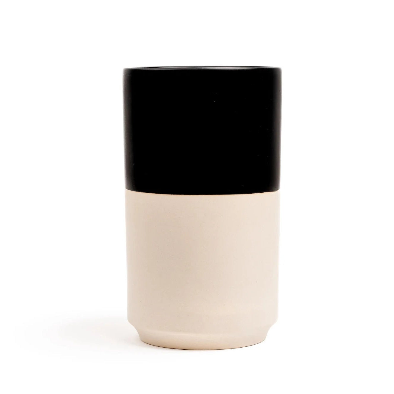 Two-toned ceramic vase with black top and beige bottom on a white background