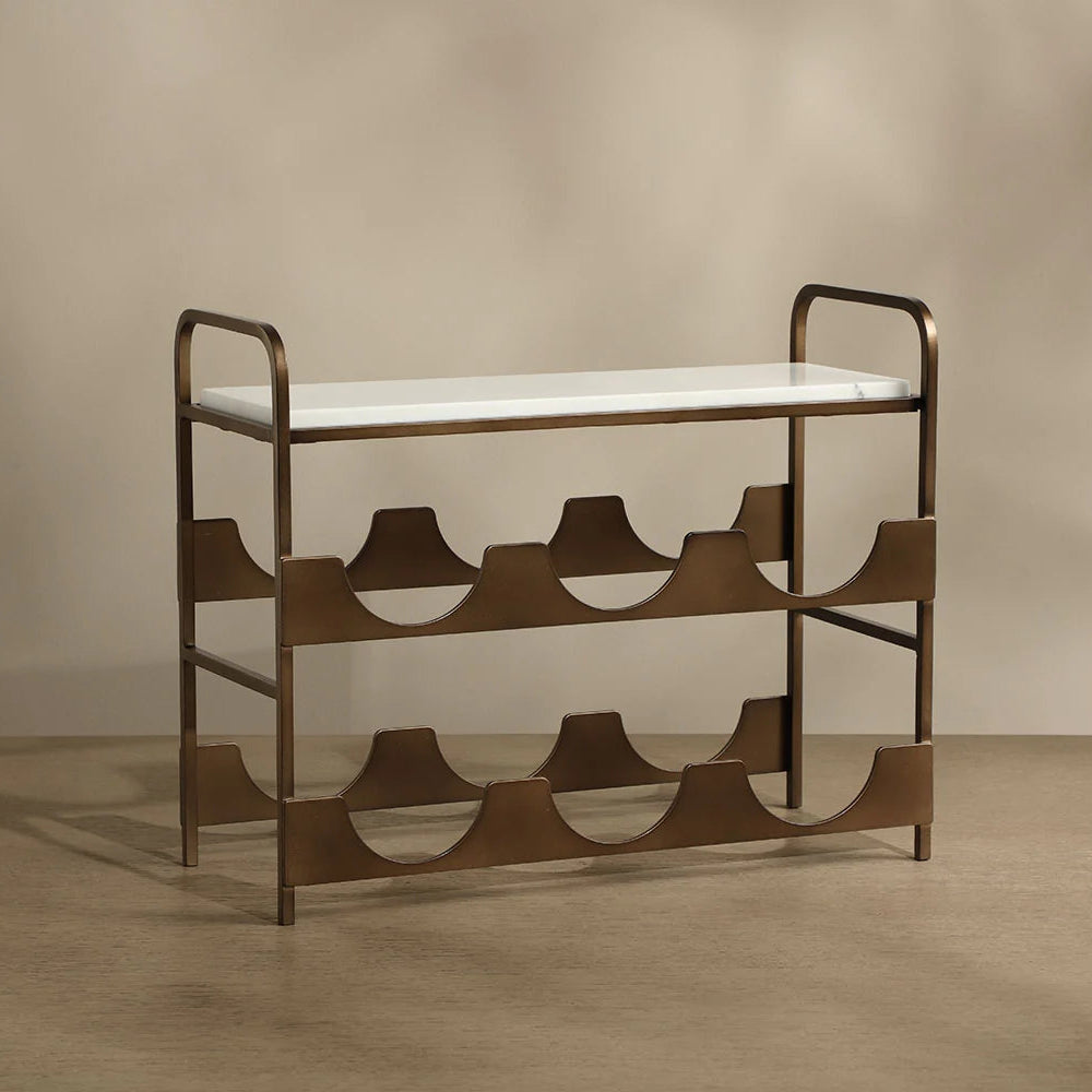 A mid-century modern metal shoe rack with a white upholstered seat and a bronze-finished frame, set against a warm beige background.