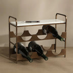 A modern wine rack with a bronze metal frame and a white marble top, shown holding three wine bottles. The background is a clean, neutral beige studio setting.